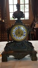 pendule en bronze à patine