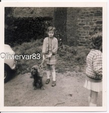 Vintage photo - little girl and dog outdoor
