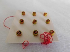 1 ROSETTE SUR FIL NICHAM