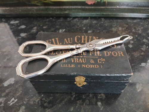 Pince sucre manche argent - à,