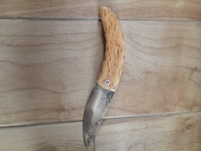 Couteau pliant deux clous