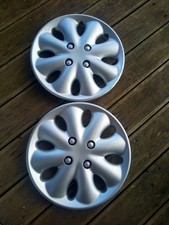 2 Enjoliveurs d´origine