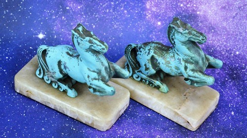 Pair horse bookends on - of,