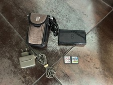 Nintendo DS Lite + chargeur + pochette de transport + 2 jeux