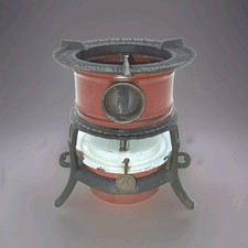 Ancien poêle à pétrole GEORG HALLER en fonte émaillée brûleur émaillé