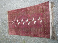 Tapis d'orient tissé main dans les rouges (G)