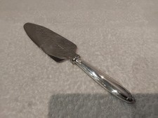 Pelle à tarte coupante ou