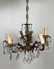 Ancien lustre en bronze à 5 branche décor chérubin et pampilles style Louis XV