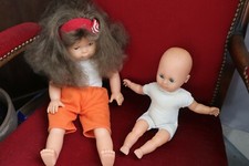 Poupon ancien aux yeux bleus