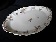 Grand plat ovale en porcelaine de Limoges style rocaille fin XIXème 