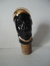 Bouchon ancien avec personnage