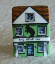 Dé à coudre de collection en porcelaine décoré en forme de boutique Anglaise