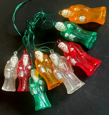 Décoration Noël vintage  Ancienne guirlande électrique 8 Pères Noël multicolores