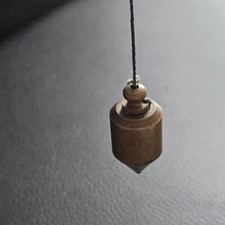 Pendule divinatoire en bronze croyances spiritisme curiosité