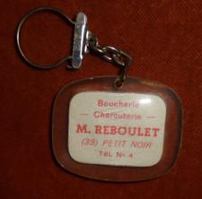 Porte-clés Boucherie Charcuterie M. REBOULET 39 PETIT-NOIR c'est pas du boudin !