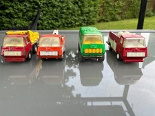 4 camions TONKA ( benne,depanneuse, pompier,mini bus )