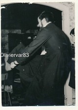 Vintage party photo - man costumed like priest dancing at a party