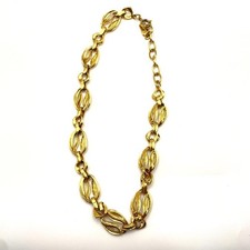Collier Yves Saint Laurent chaîne dorée YSL
