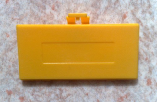 Cache pile jaune - neuf, pour