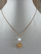 Collier flocon de neige et œil de chat