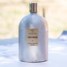 Fragonard  Flacon De Parfum En Aluminium. Entamé. Hauteur :157mm Poids : 468g.