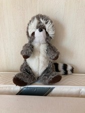 Peluche raton laveur assis