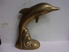 Sculpture grand dauphin sur la vague en bronze