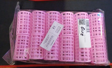 Bigoudis rouleaux cheveux rose