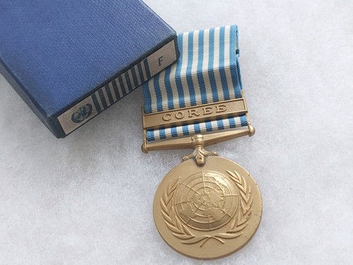 Une médaille des nations unis - médaille,