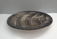 Plat rond ancien en faience de Salins décor noir dans le style de Soulages