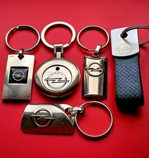OPEL LOT 5 PORTE CLES LOGO AUTOMOBILE tous différents