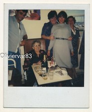 Vintage color instant photo 1970s - women laughing on a snapshot photo