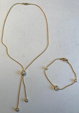 Chaine et bracelet dorés avec trois strass