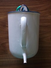 ancienne  fontaine à lavement   en tôle émaillée.pot