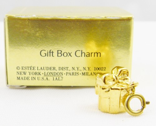 Estee lauder gold tone charm - gold,