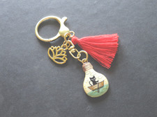 Bijou de sac acier inoxydable chat pompon lotus