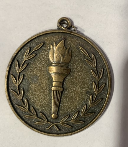 Vintage brass torch medallion - vintage.,