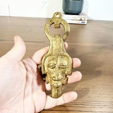 Décapsuleur ancien en laiton