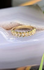 Bague demie alliance en or sertissage S ornée de 9 diamants d'environ 0,27ct au