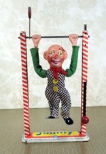 Jouet tôle mécanique ancien  "Jimmy clown trapéziste."  Arnold. Années 1930-1950