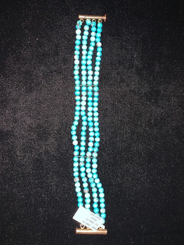 Turquoise and gold filled four - and,