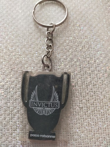 Porte clé invictus - invictus, paco