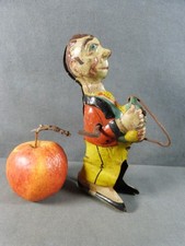 Jouet ancien : Figurine à remontoir en tôle années 1930, homme à hélice