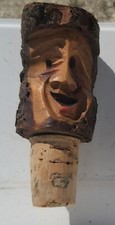 ancien bouchon sculpté en bois représentant un personnage
