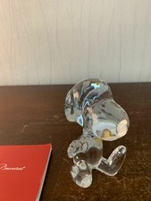 2 Snoopy assis en cristal de Baccarat (prix à la pièce)