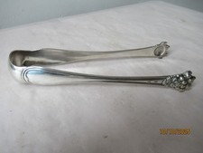 Pince à sucre métal argenté CAILAR BAYARD . Poinçons. Patte de lion. Bel état.