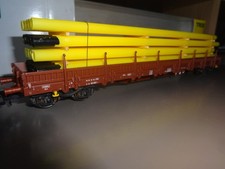 TRIX HO 24344  Wagon plat Res de la DR chargé de tubes long.