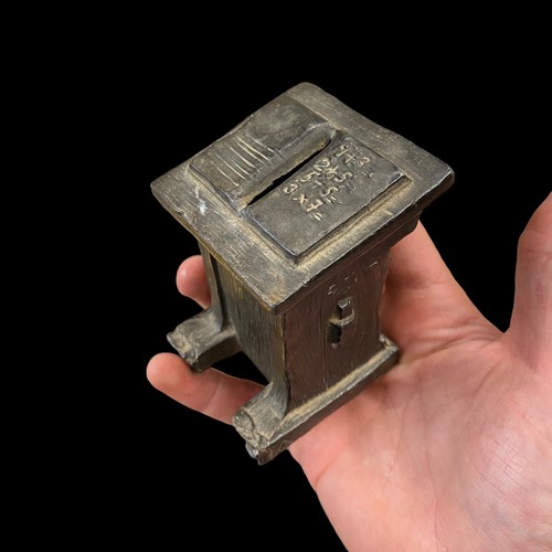 Ancienne tirelire trompe - en,