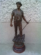 regule statuette mineur