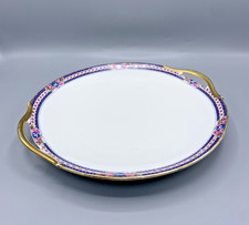 Grand plat rond à anses en porcelaine de Limoges T.L.B. – décor fleuri et dorure